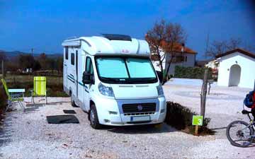 Camper van at the camping pitch in Camp TERRE 